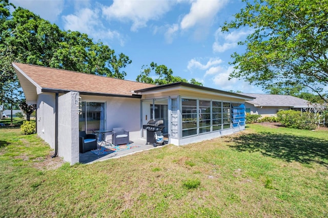 1657 Glengarry Dr, Palm Harbor, FL 34684 - back of house featuring a yard, a patio area, and stucco siding