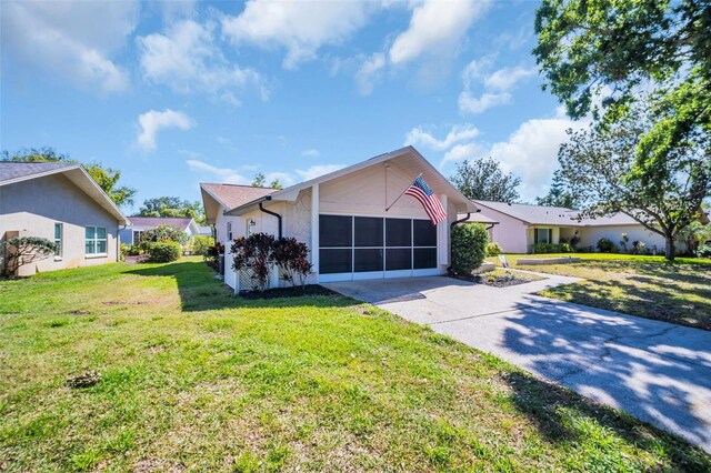 1657 Glengarry Dr, Palm Harbor, FL 34684 - ranch-style home featuring a garage, stucco siding, driveway, and a front yard