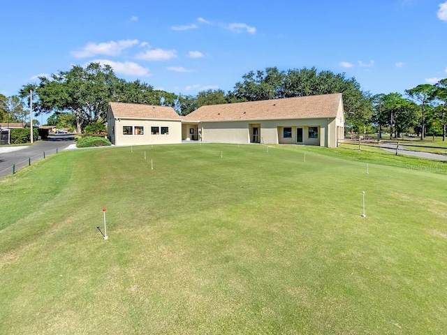 1657 Glengarry Dr, Palm Harbor, FL 34684 - rear view of property with stucco siding and fence
