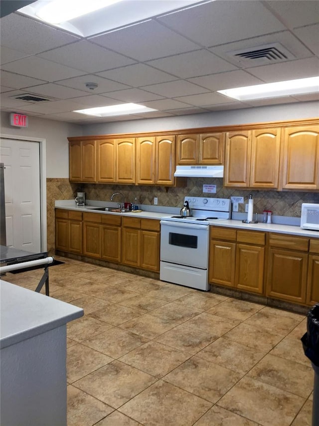 1657 Glengarry Dr, Palm Harbor, FL 34684 - kitchen featuring visible vents, white appliances, light countertops, a paneled ceiling, and under cabinet range hood