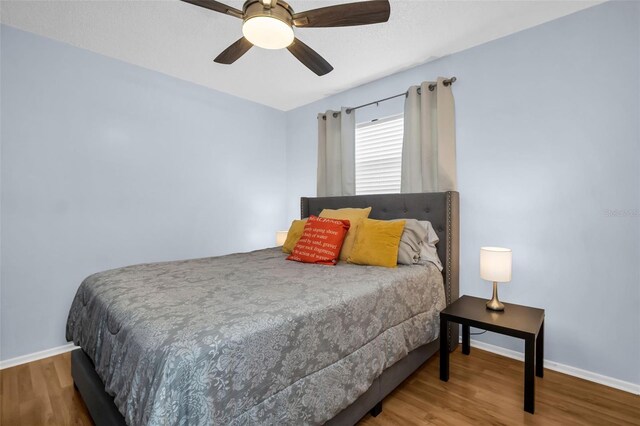1657 Glengarry Dr, Palm Harbor, FL 34684 - bedroom featuring baseboards, ceiling fan, and wood finished floors