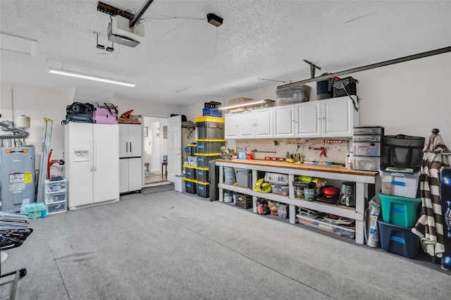 1657 Glengarry Dr, Palm Harbor, FL 34684 - garage with a workshop area, a garage door opener, and water heater