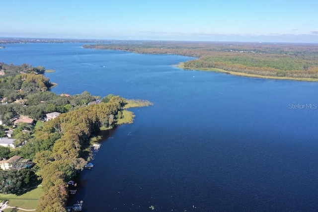 1657 Glengarry Dr, Palm Harbor, FL 34684 - drone / aerial view of a nearby body of water and a heavily wooded area