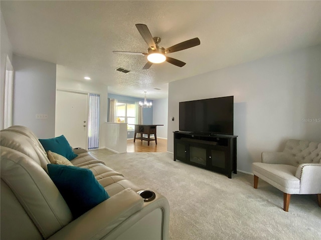 1657 Glengarry Dr, Palm Harbor, FL 34684 - living area with a chandelier, ceiling fan, and light carpet