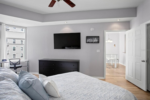 bedroom featuring recessed lighting, baseboards, a ceiling fan, and wood finished floors