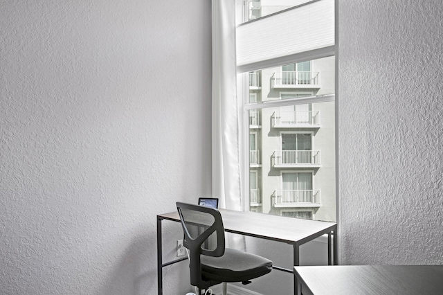 home office featuring a textured wall