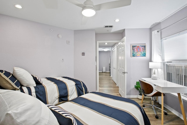 bedroom featuring recessed lighting, baseboards, a ceiling fan, and light wood-style floors