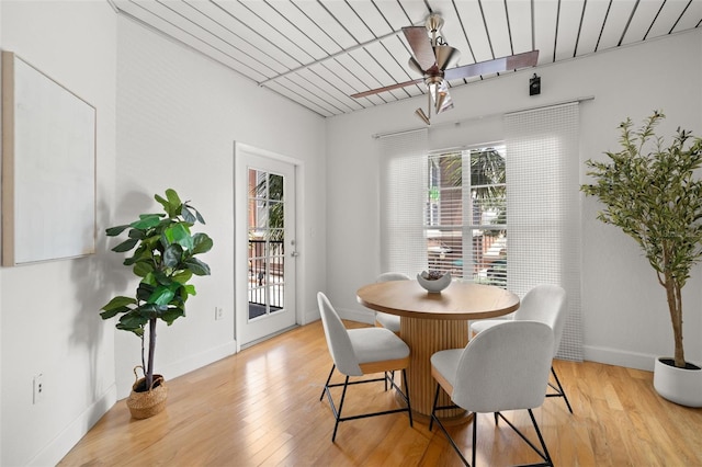 2410 W Azeele St Unit 228, Tampa, FL 33609 - dining room with plenty of natural light and light wood finished floors