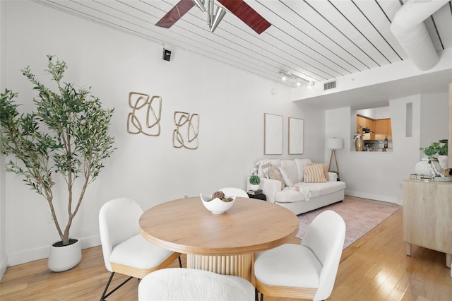 2410 W Azeele St Unit 228, Tampa, FL 33609 - dining room featuring ceiling fan, light wood finished floors, and track lighting
