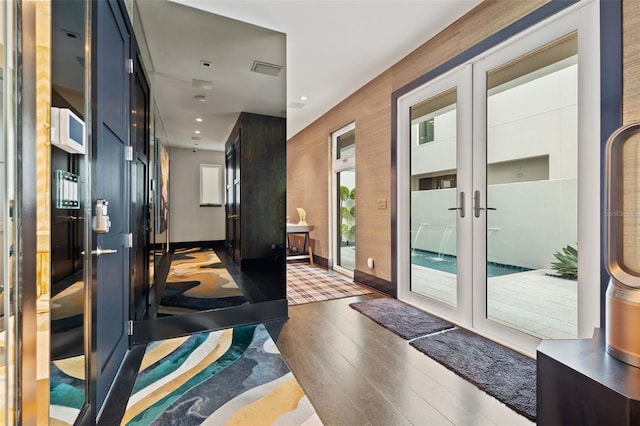 325 2nd St N, Saint Petersburg, FL 33701 - doorway featuring recessed lighting, wood finished floors, visible vents, french doors, and baseboards