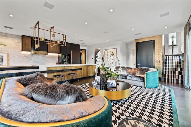 325 2nd St N, Saint Petersburg, FL 33701 - living area featuring visible vents, wood finished floors, and recessed lighting