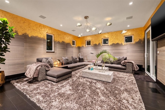 325 2nd St N, Saint Petersburg, FL 33701 - living area with dark tile patterned flooring, an inviting chandelier, and recessed lighting