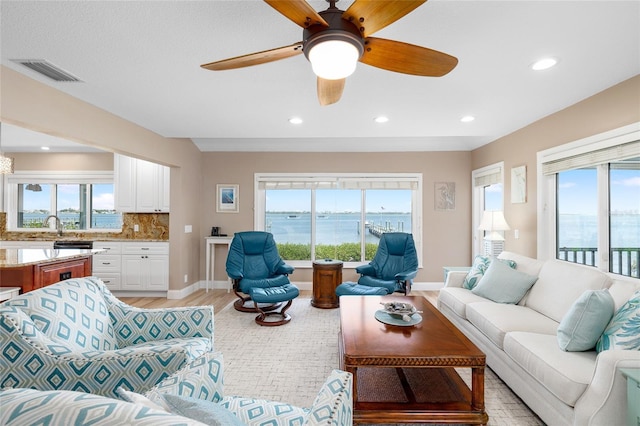 9048 Wharf Ave, Placida, FL 33946 - living room featuring visible vents, recessed lighting, light wood-style floors, and a ceiling fan