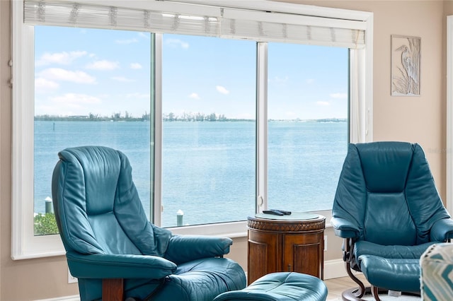 9048 Wharf Ave, Placida, FL 33946 - sitting room with a water view and wood finished floors