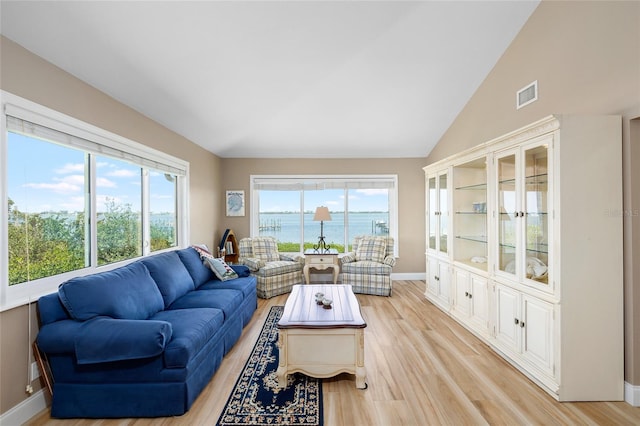 9048 Wharf Ave, Placida, FL 33946 - living area with visible vents, light wood finished floors, and plenty of natural light