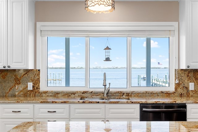 9048 Wharf Ave, Placida, FL 33946 - kitchen featuring tasteful backsplash, white cabinets, light stone countertops, dishwasher, and a sink