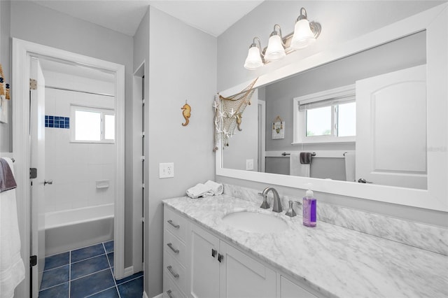 9048 Wharf Ave, Placida, FL 33946 - bathroom with a wealth of natural light, tile patterned flooring, vanity, and bathing tub / shower combination