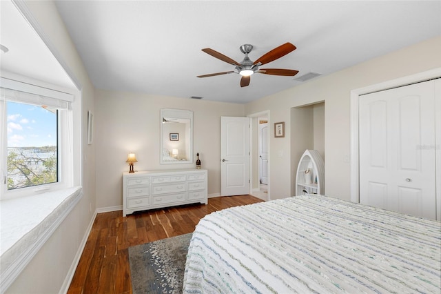 9048 Wharf Ave, Placida, FL 33946 - bedroom featuring a closet, baseboards, a ceiling fan, visible vents, and wood finished floors
