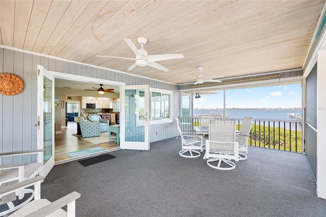 9048 Wharf Ave, Placida, FL 33946 - sunroom / solarium featuring a ceiling fan and a water view