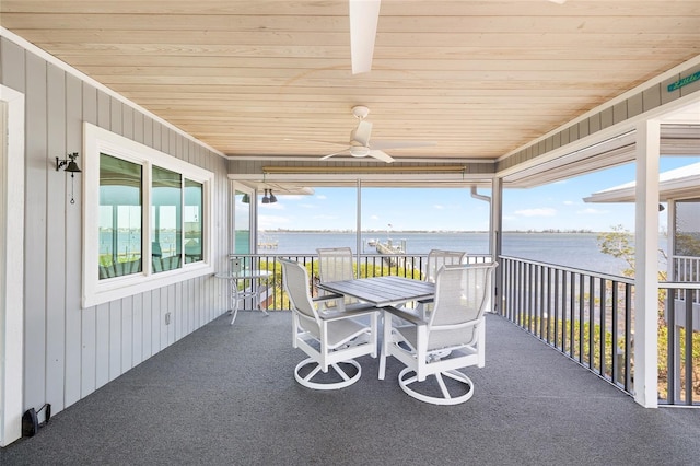 9048 Wharf Ave, Placida, FL 33946 - sunroom / solarium with a water view, ceiling fan, and outdoor dining space