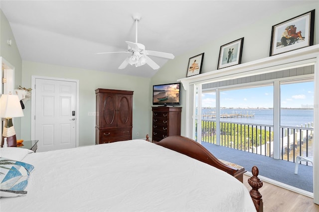 9048 Wharf Ave, Placida, FL 33946 - bedroom featuring ceiling fan, access to outside, wood finished floors, and vaulted ceiling