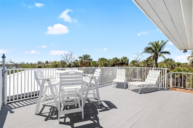 9048 Wharf Ave, Placida, FL 33946 - wooden deck featuring outdoor dining space