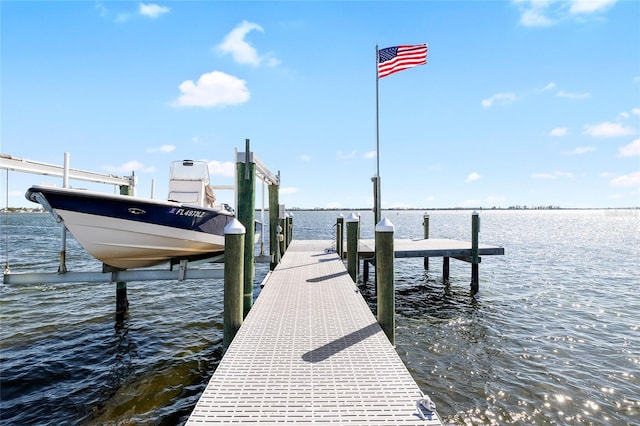 9048 Wharf Ave, Placida, FL 33946 - view of dock featuring boat lift and a water view