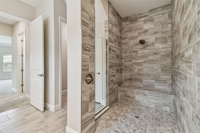 bathroom with tiled shower