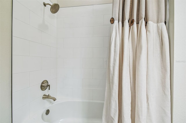 full bath featuring shower / tub combo with curtain