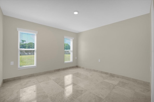 3506 Seaway Dr, New Port Richey, FL 34652 - unfurnished room with baseboards and plenty of natural light