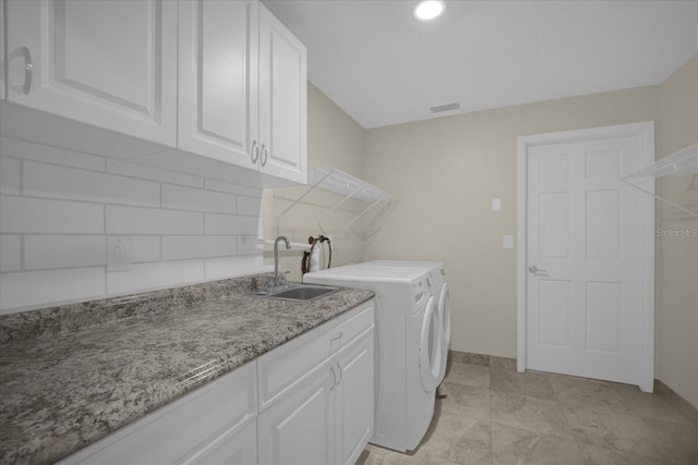 3506 Seaway Dr, New Port Richey, FL 34652 - laundry area featuring baseboards, visible vents, independent washer and dryer, cabinet space, and a sink