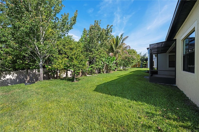 view of yard with a fenced backyard