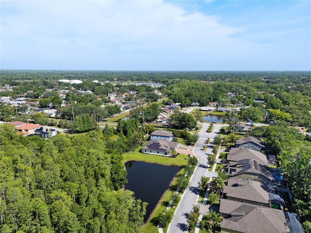 drone / aerial view with a water view and a residential view