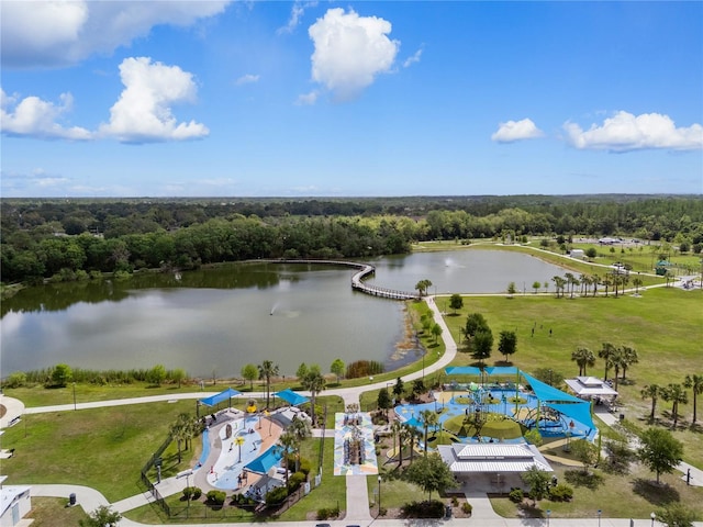 birds eye view of property with a water view and a view of trees
