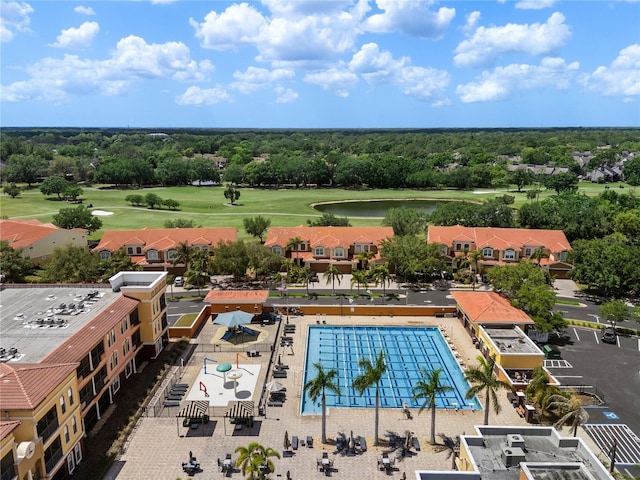 bird's eye view featuring view of golf course and a water view