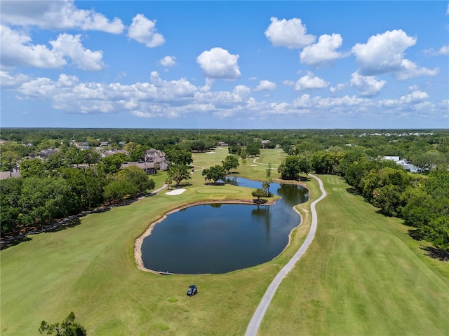 aerial view with golf course view and a water view