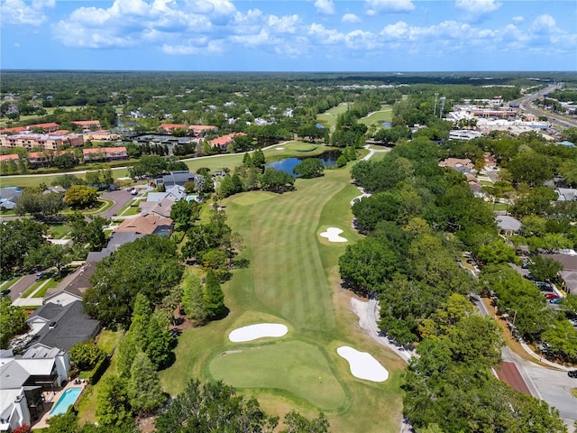 drone / aerial view with a residential view, a water view, and view of golf course