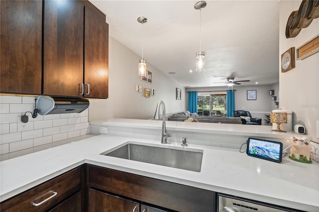 14910 Par Club Cir, Tampa, FL 33618 - kitchen featuring open floor plan, dishwasher, a sink, and dark brown cabinetry