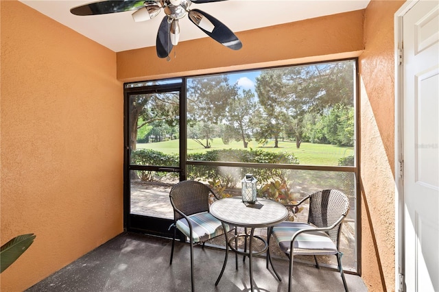 14910 Par Club Cir, Tampa, FL 33618 - sunroom / solarium with a ceiling fan and view of golf course