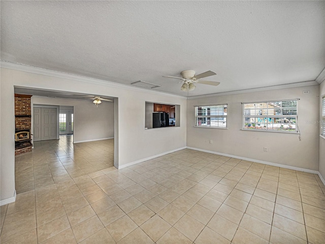 unfurnished room featuring crown molding, light tile patterned floors, and ceiling fan