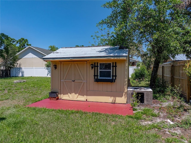 view of shed with a fenced backyard