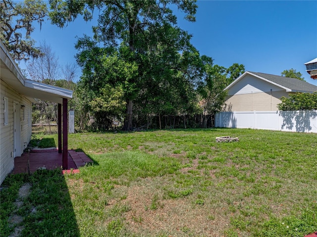 view of yard with a patio and fence