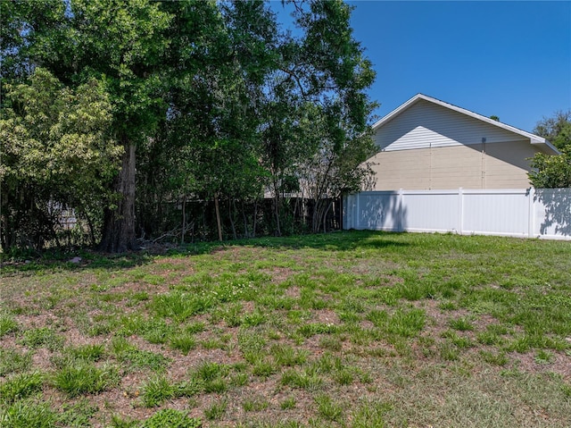 view of yard featuring fence