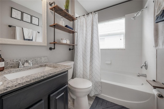bathroom featuring vanity, toilet, and shower / tub combo