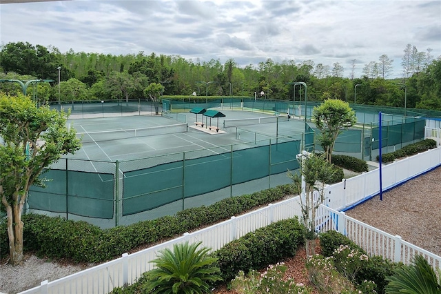 view of sport court with fence