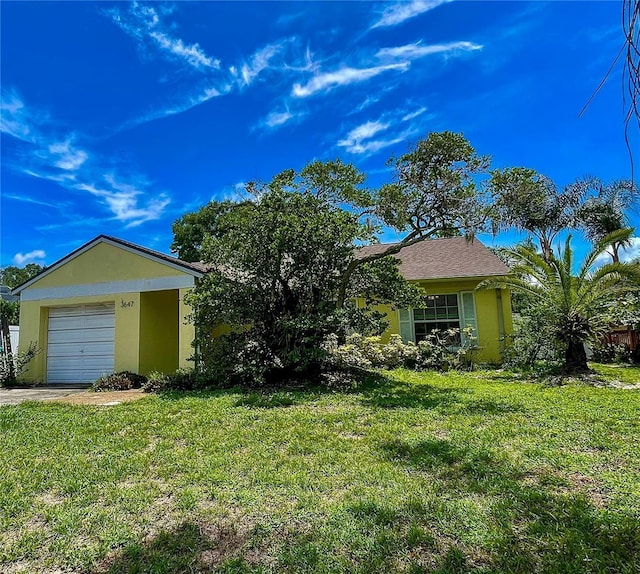 3647 Lake St, George Drive, Palm Harbor, FL 34684 - view of front of house with a front yard, stucco siding, and driveway