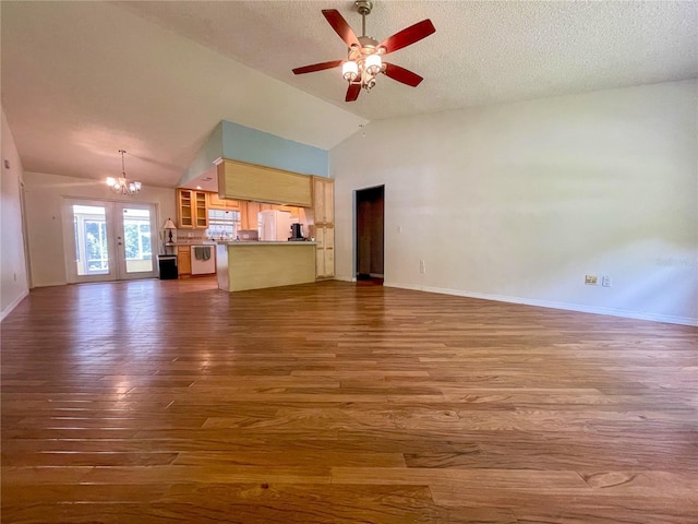 3647 Lake St, George Drive, Palm Harbor, FL 34684 - unfurnished living room featuring a chandelier, dark wood-type flooring, lofted ceiling, ceiling fan, and a textured ceiling