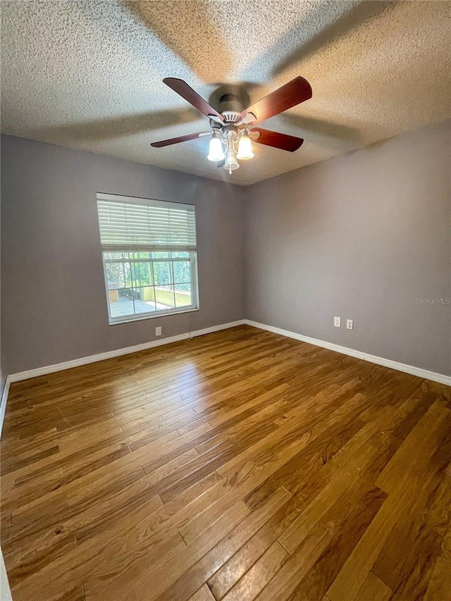 3647 Lake St, George Drive, Palm Harbor, FL 34684 - spare room with wood finished floors, a ceiling fan, and a textured ceiling