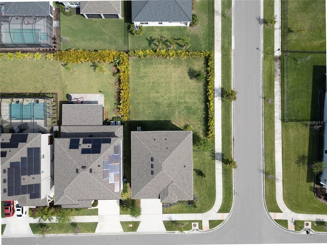 birds eye view of property with a residential view