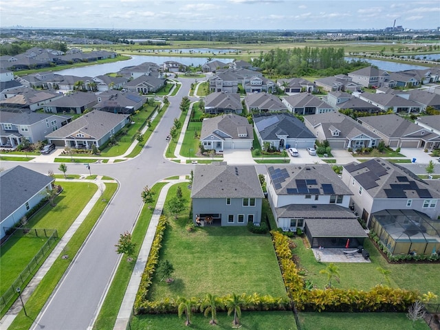 bird's eye view with a water view and a residential view
